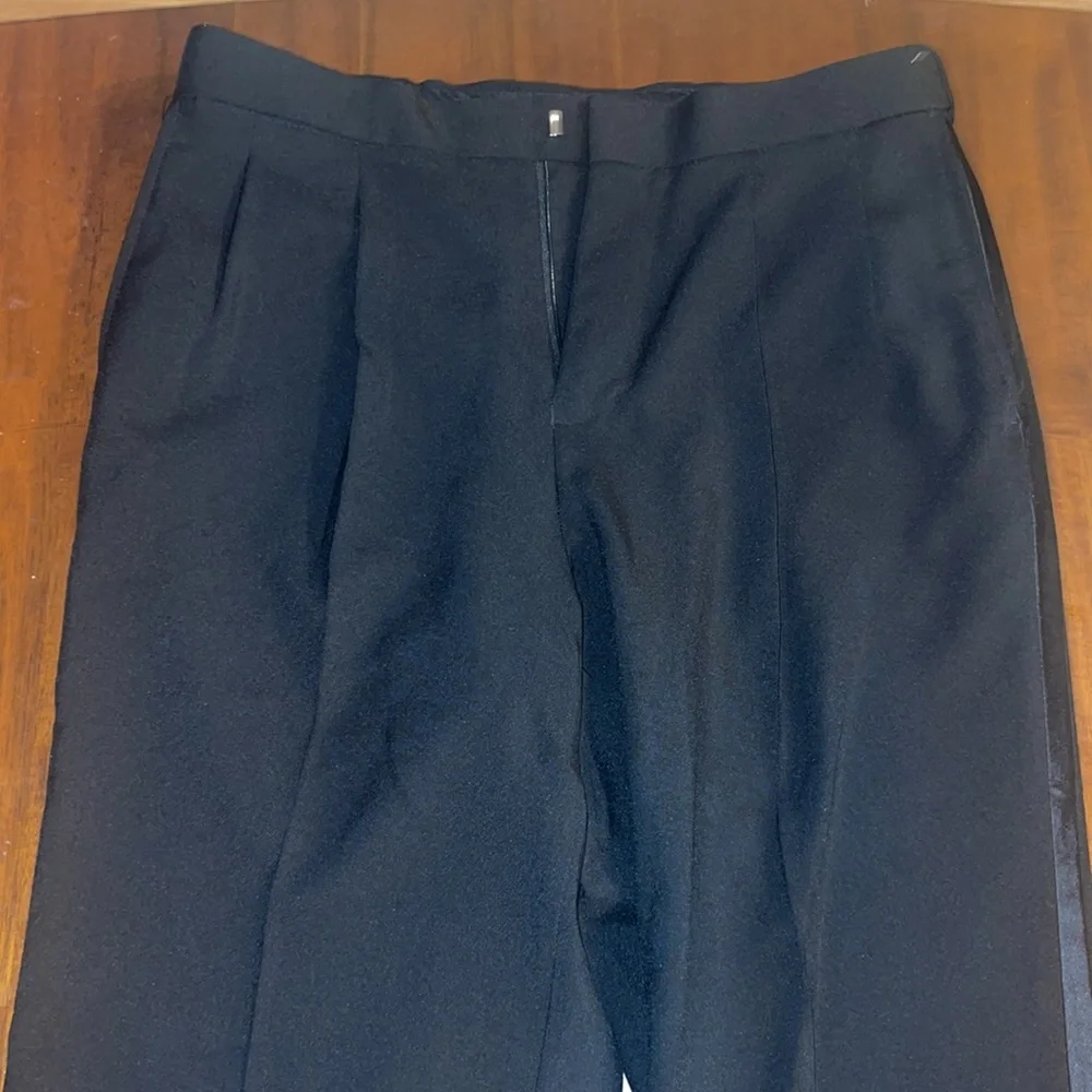 Formal Fashions men’s black tuxedo jacket and pants. Jacket 38S, Pants 34x34